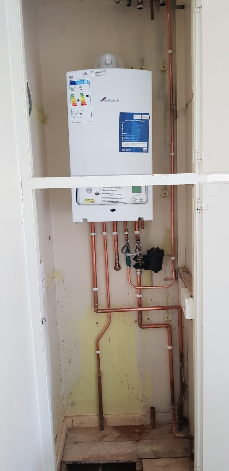 Worcester boiler in an airing cupboard with new copper pipework and magnetic filter